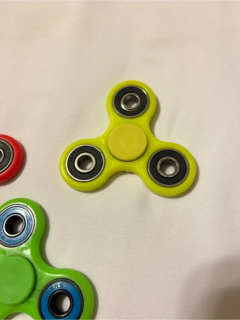 Lot of 3 Fidget Spinners ESPN Dish Network Plastic Toy Red Green Yellow